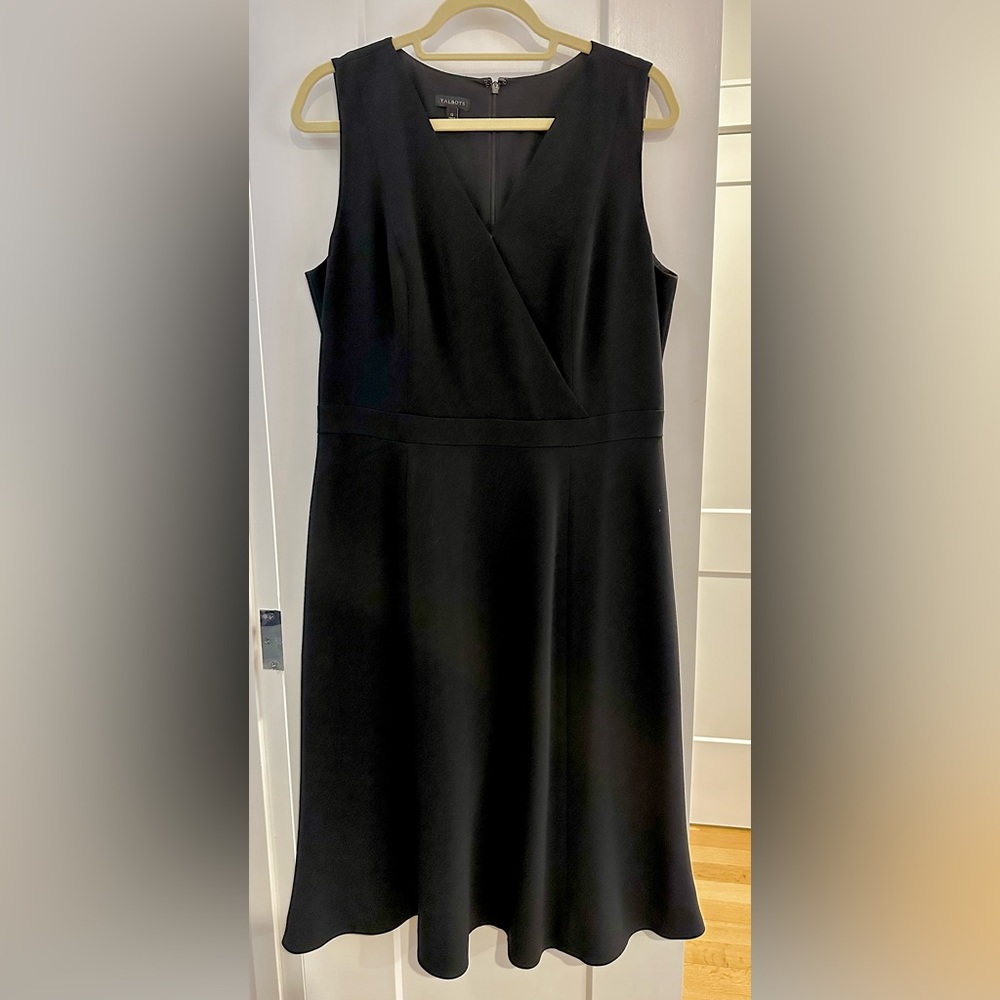 Sophisticated black dress, flattering neckline, gorgeous drape, and pockets!